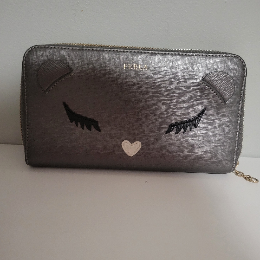 Furla EUC saffiano leather detailed with iconic baby bear shape.